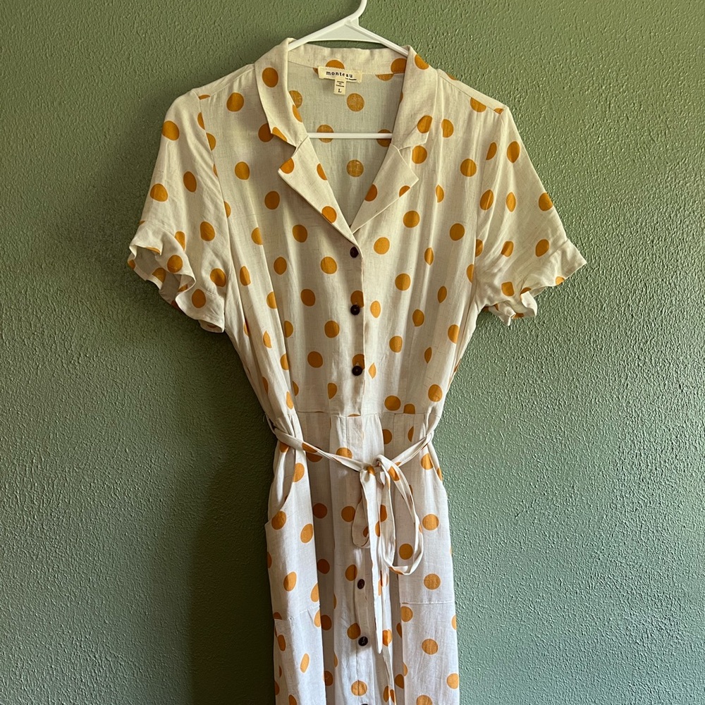 Yellow polka dot button-up tie dress with ruffle sleeves